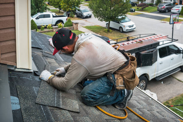 Professional Storm Damage Roof Repair technician working in Oakland City, IN